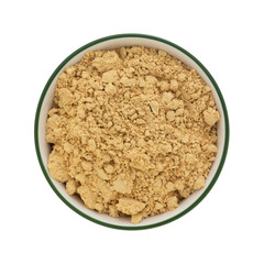 Top view of peanut powder in a bowl on a white background.