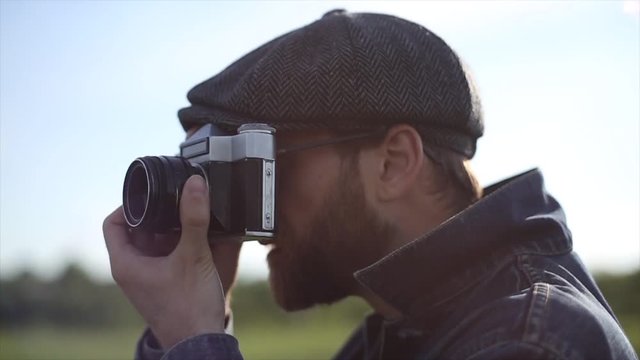 Hipster Photographer Take a Pictures With Vintage Camera