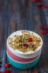 Granola with yoghurt, dried berries and pumpkin seeds
