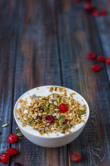 Granola with yoghurt, dried berries and pumpkin seeds