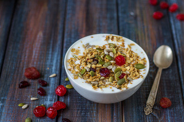Granola with yoghurt, dried berries and pumpkin seeds