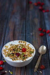 Granola with yoghurt, dried berries and pumpkin seeds