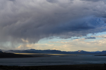 Threatening storm clouds are hanging low over mono lake, near the town of Lee Vining, in the Sierra Nevada mountain range. Sierra Nevadas, Eastern California, USA.