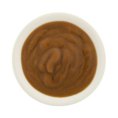 Pears and blackberry organic baby food in a small bowl.