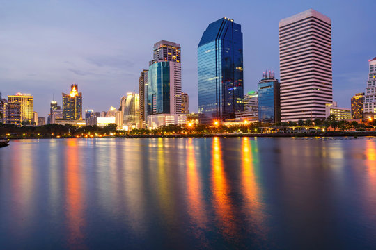 Bangkok city downtown at twilight with reflection of skyline, Benjakiti Park, Bangkok,Thailand
