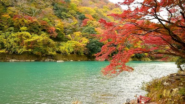 Arashiyama in autumn season along the river in Kyoto, Japan.