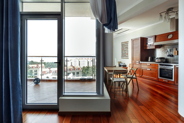 Modern house, Kitchen room with the modern furniture and a picturesque view of the city