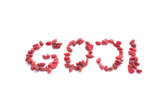 Goji Berries shaped into word 'goji' isolated on white