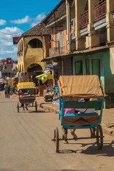 Fototapeta na wymiar Man-powered carts (Pousse pousse) in the historic center of Amabalavao, Madagascar