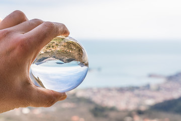 Budva reflected in a glass ball