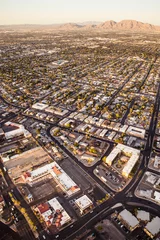 Poster Aerial view across urban suburban communities seen from Las Vegas Nevada with streets, rooftops, and homes © littleny
