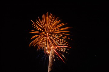 fireworks going off at night in the summer time