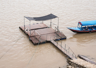 Old local pontoon with the long tail boat.