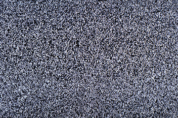 Television screen with static noise caused by bad signal reception or no signal. Abstract...
