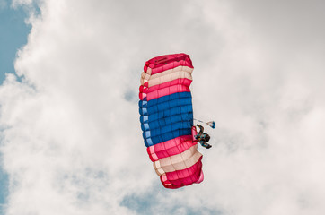 skydiver with a parachute in the open sky. aviation sport.