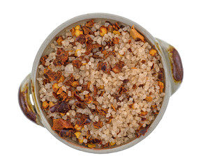 Top view of Greek spice rub in a small bowl isolated on a white background.