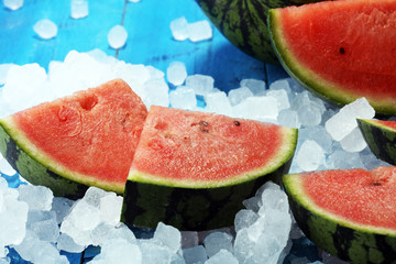 watermelon on blue background. juicy summer fruit in slices