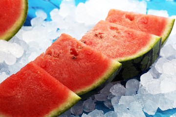 watermelon on blue background. juicy summer fruit in slices