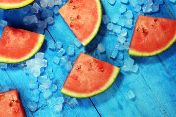 watermelon on blue background. juicy summer fruit in slices