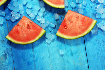watermelon on blue background. juicy summer fruit in slices