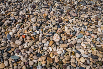 Colorful stones in the sea water