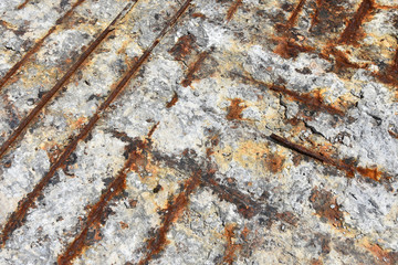 Rough weathered rusty surface of reinforced concrete floor