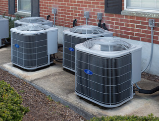 Air conditioning units outside an apartment complex