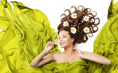 Obraz na płótnie Canvas Woman Flowers in Hair Curls, Beauty Model Floral Hairstyle, Girl Smell Daisy Flower, Flying Fluttering Green Dress Fabric
