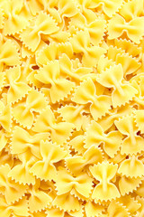 Raw farfalle italian pasta background