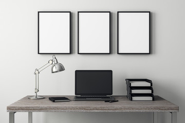 Modern interior with laptop and frame