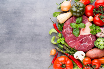 Raw fresh meat Ribeye Steak with vegetables and spice.