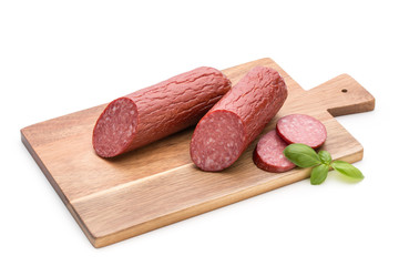 Salami smoked sausage, basil leaves on white background cutout.