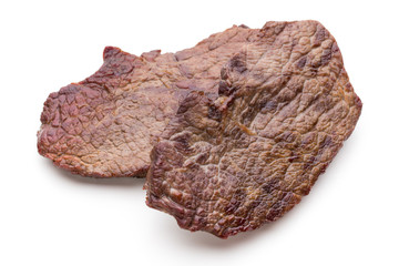 Grilled beef steaks with spices isolated on white background.