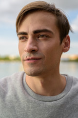 Fototapeta premium Young handsome man relaxing at the park