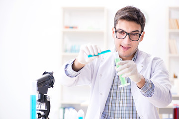 Chemistry student doing chemical experiments at classroom activi