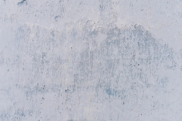 Plaster of blue and white.The texture of the old cracked paint on the wall.