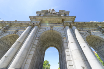 Obraz premium Puerta de Alcala is a one of the Madrid ancient doors of the city of Madrid, Spain. It was the entrance of people coming from France, Aragon, and Catalunia. It is a landmark of the city.