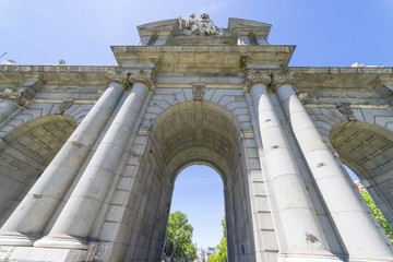Fototapeta premium Puerta de Alcala is a one of the Madrid ancient doors of the city of Madrid, Spain. It was the entrance of people coming from France, Aragon, and Catalunia. It is a landmark of the city.
