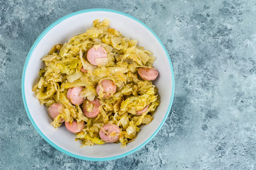 Stewed cabbage with sausages