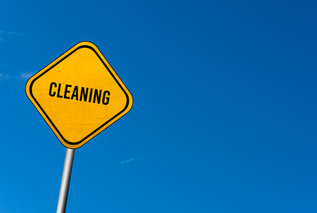 Fototapeta premium cleaning - yellow sign with blue sky