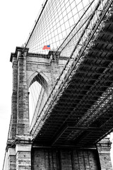 Detail of Brooklyn Bridge tower with flag
