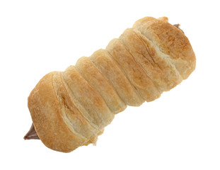 Top view of a chocolate creme horn on a white background.
