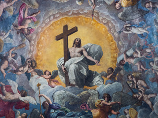Ceiling of a cathedral chapel painted with the image of Jesus Christ surrounded by the angels of paradise. - 205690468