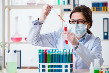Female chemist working in hospital lab