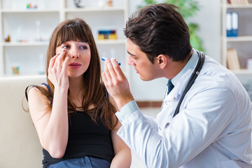 Doctor checking up patient in first aid concept