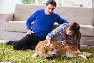 Happy family with golden retriever dog