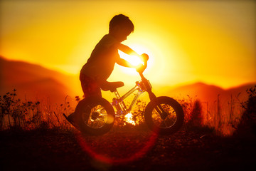 Fototapeta na wymiar boy riding bike