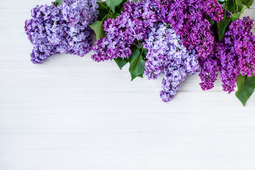 Beautiful lilac on a wooden background