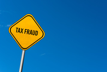 tax fraud - yellow sign with blue sky
