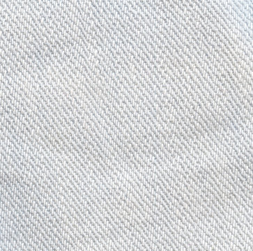 Light jeans texture background. White color canvas